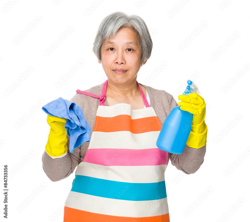 Old asian housewife hold with rag and plastic bottle Old asian housewife hold with rag and plastic bottle