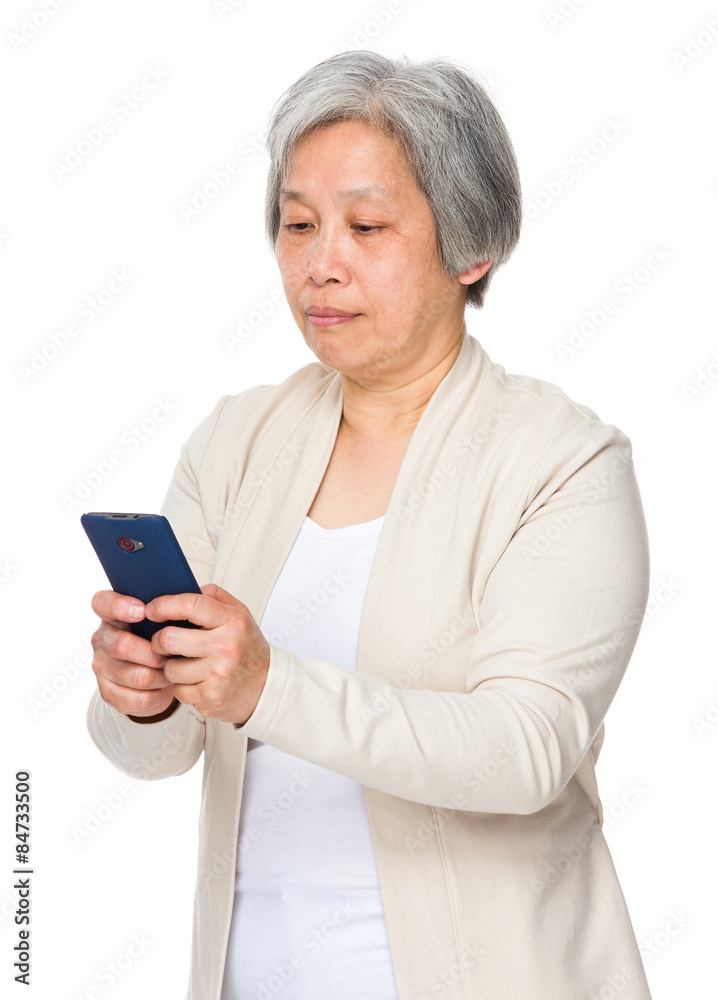 Retired woman read on smartphone Retired woman read on smartphone