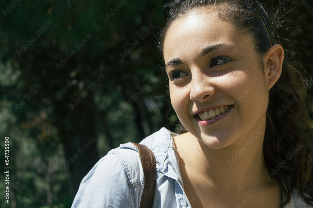 Young beautiful woman smiling in a park Young beautiful woman smiling in a park