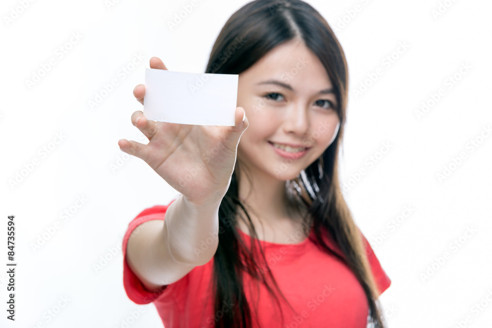 Asian woman holding up blank business card Asian woman holding up blank business card