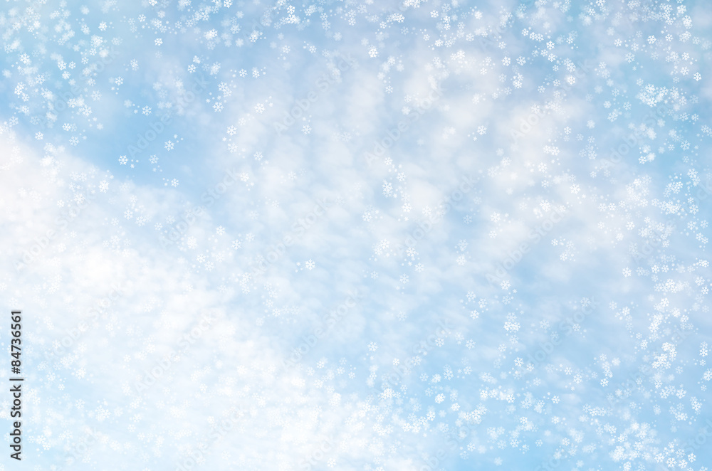 Falling snowflakes on  blue background