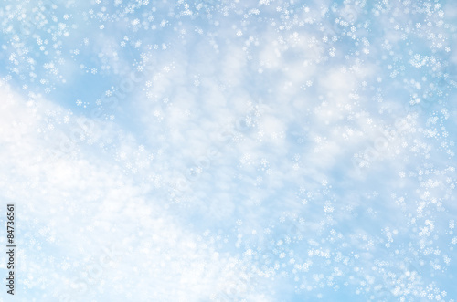 Falling snowflakes on blue background