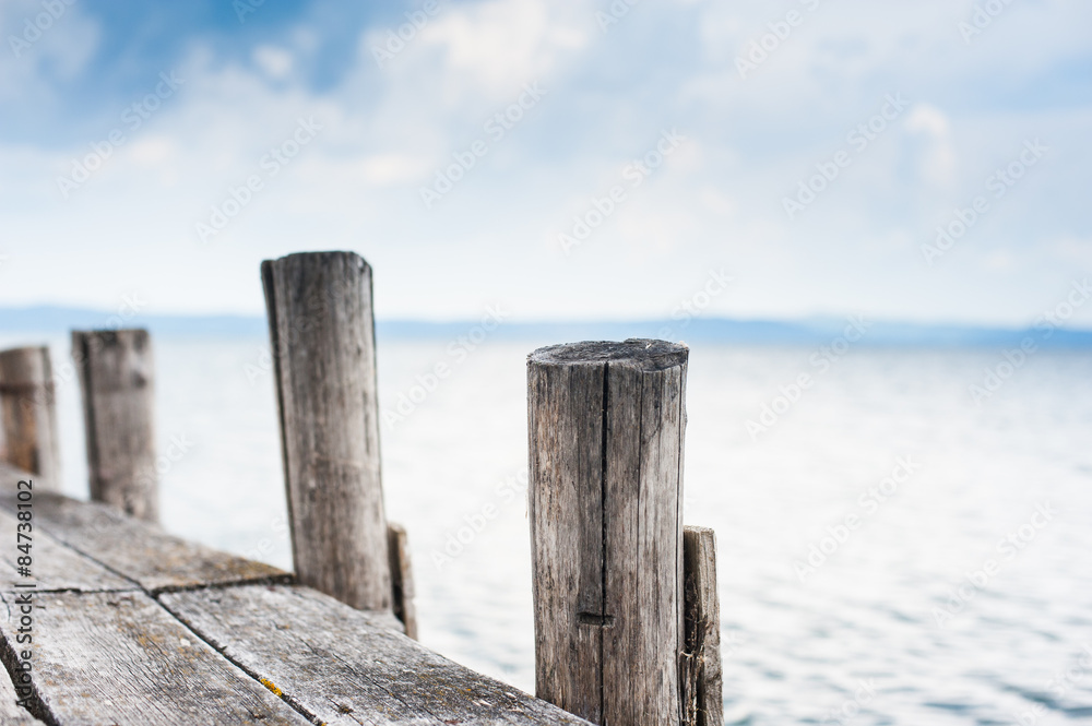 Wooden jetty stake in autumn day Wooden jetty stake in autumn day