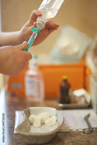 Nurse hands preparing intravenous drip