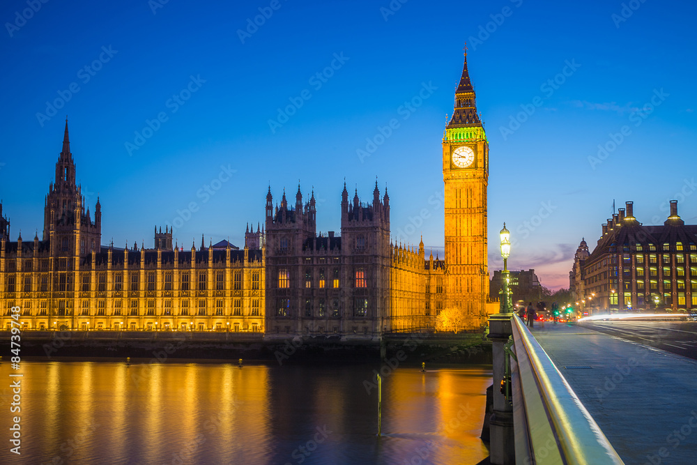 London, United Kingdom - Illuminated Big Ben with the Parliament building taken from Westminster bridge at blue hour with clear blue sky at dusk