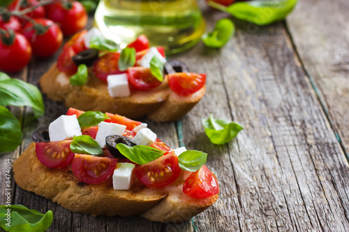 bruschetta with tomato, feta cheese and basil