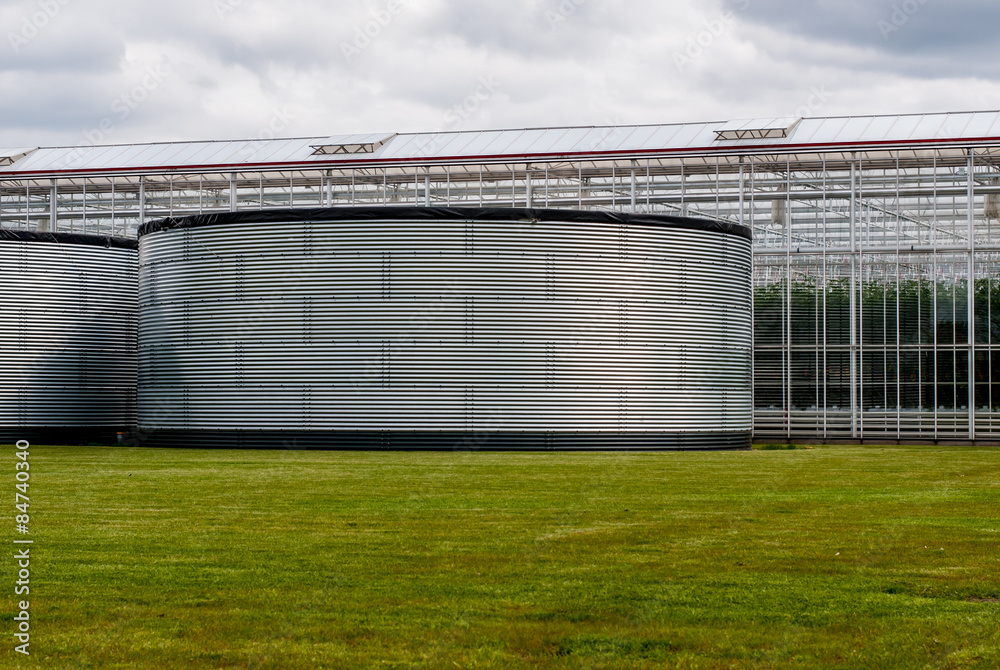 large water tanks for the storage of water for greenhouses Stock Photo
