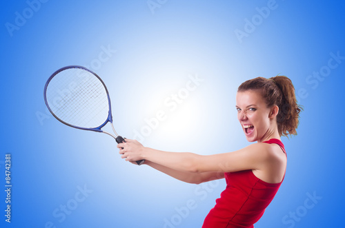 Woman playing tennis on white © Elnur
