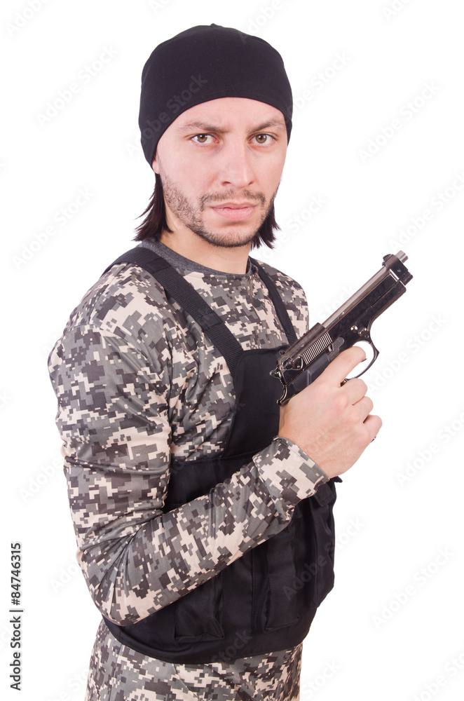 Young man in military uniform holding gun isolated on white Young man in military uniform holding gun isolated on white
