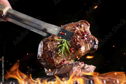 Fotografie Beef steak on grill