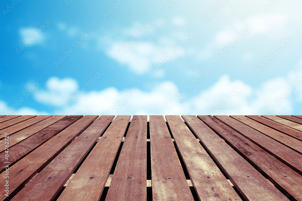 Blue sky with wooden floor