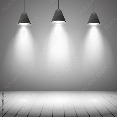 Studio interior with white wall and spot illumination