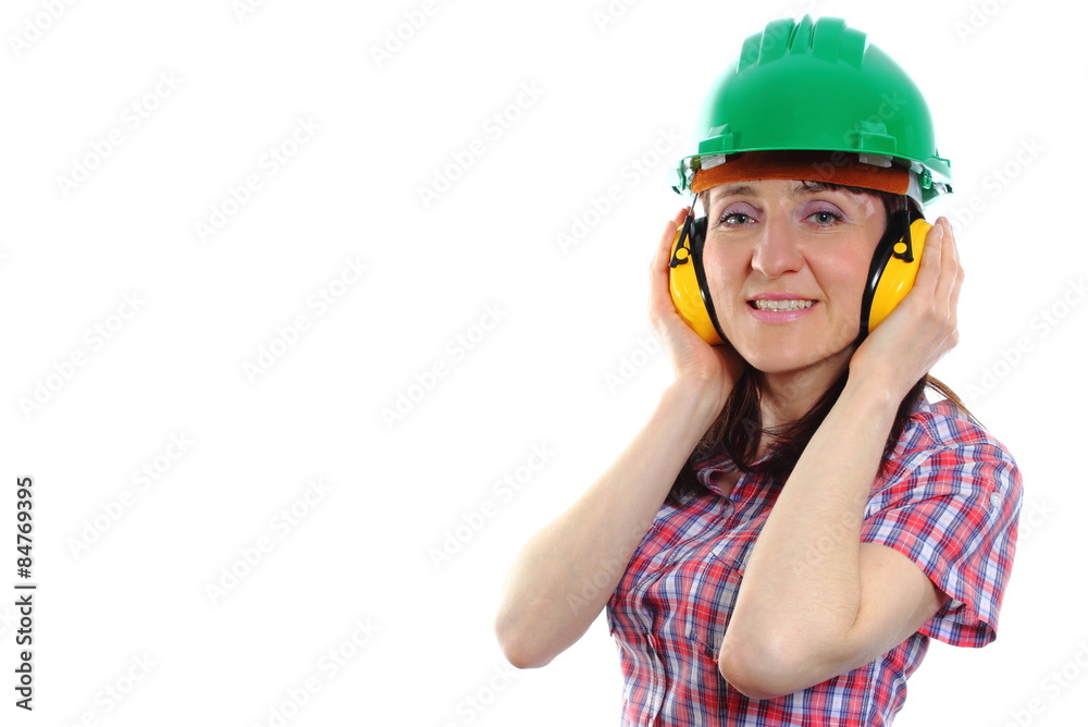 Woman wearing protective helmet and headphones