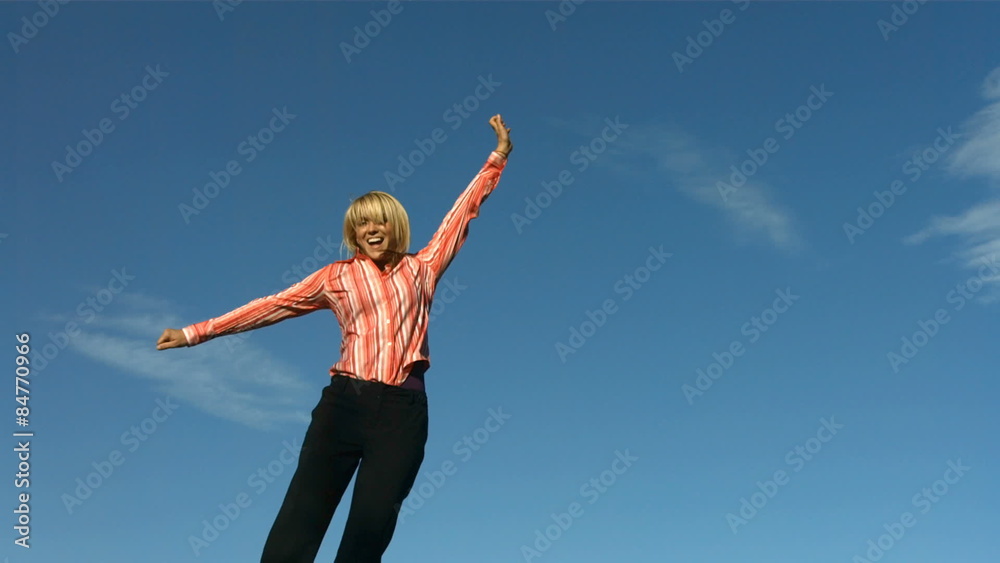 Happy woman jumps into sky, slow motion Happy woman jumps into sky, slow motion