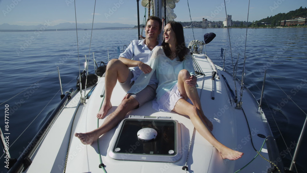 Young couple on sailboat together. Young couple on sailboat together.