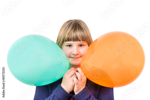Young caucasian girl holding two colorful balloons © benschonewille