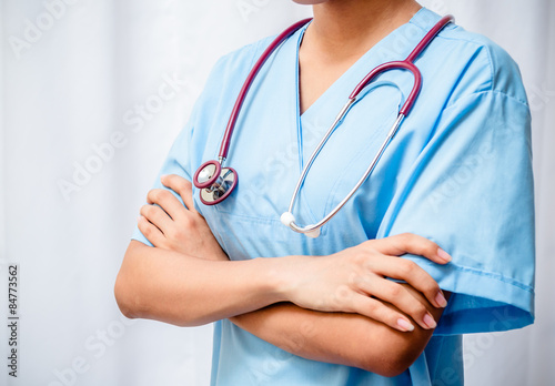 surgeon standing with arms fold across chest