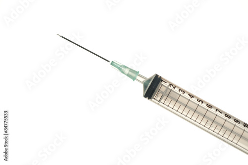 Syringe with drop isolated on white