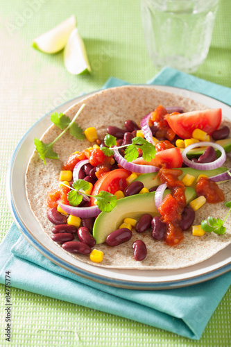 vegan taco with vegetable, kidney beans and salsa
