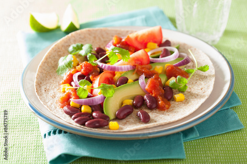 vegan taco with vegetable, kidney beans and salsa