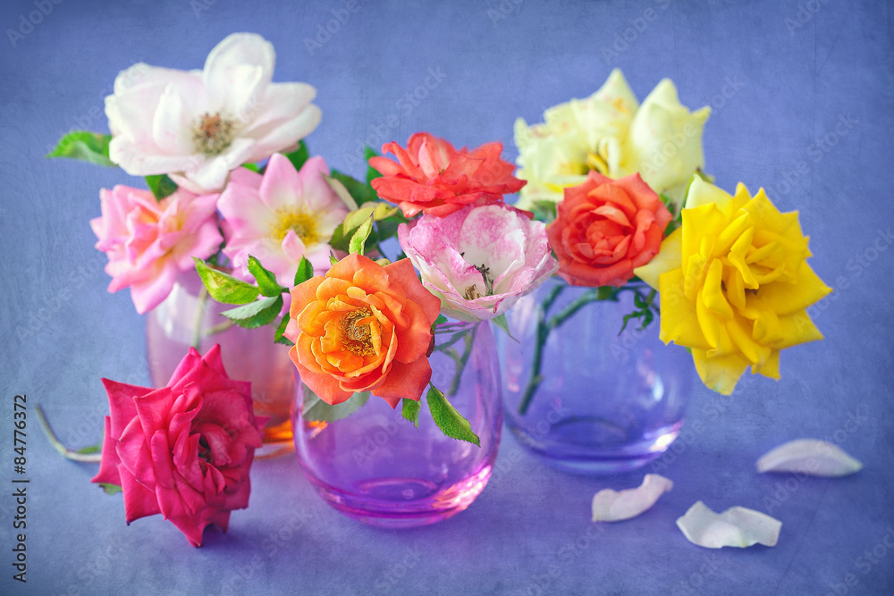 Floral composition with a roses on a table. Floral composition with a roses on a table.