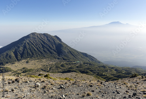 Mount Meru with Mt Kilimanjaro in the distance, near Arusha in Tanzania. Africa.