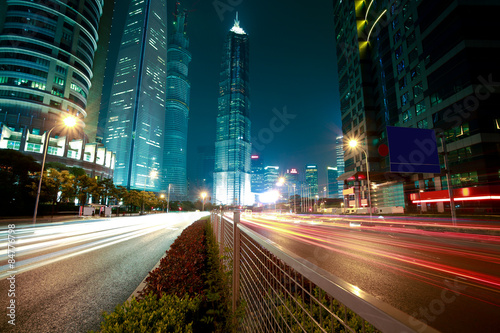 Road light trails on streetscape office buildings in shanghai