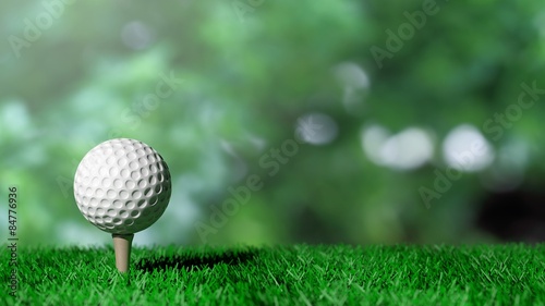 Golf ball on green turf and green background