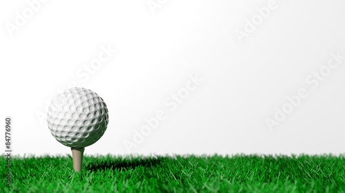 Golf ball on green turf isolated on white background