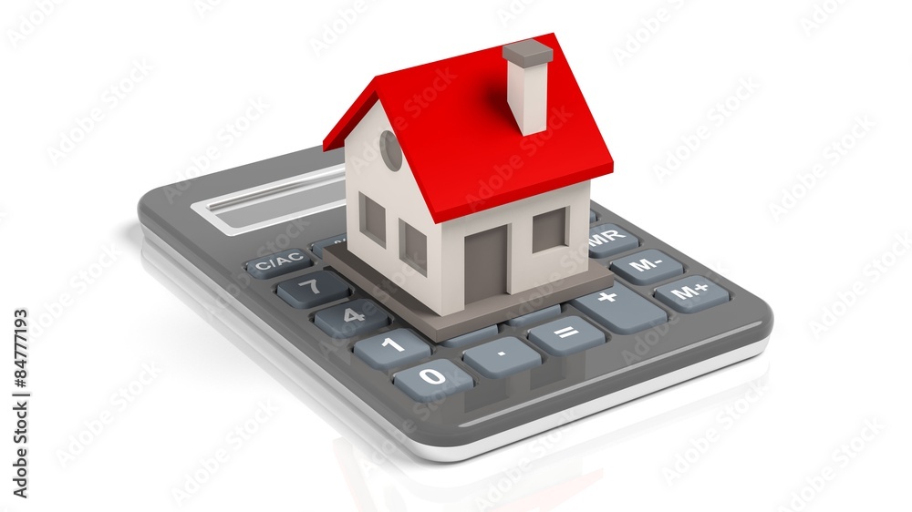 House model on a calculator isolated on white background House model on a calculator isolated on white background