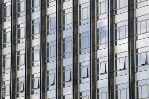 Wallpaper Mural Clouds reflected in windows of modern office building Torontodigital.ca