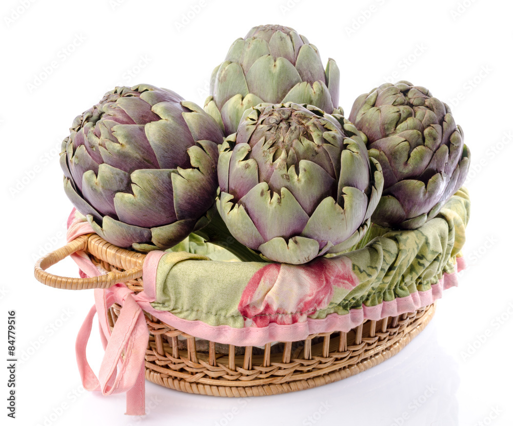 Obraz premium Fresh green purple artichokes in a basket