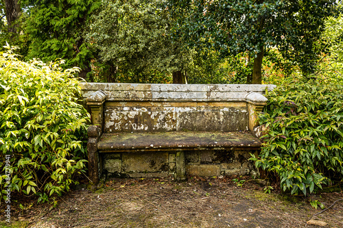 Ancient stone bench in the park
