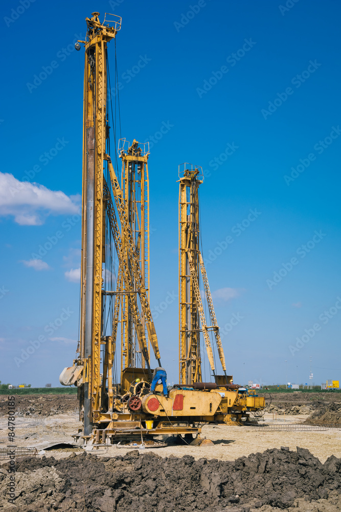 Pile driving machine in construction site Pile driving machine in construction site
