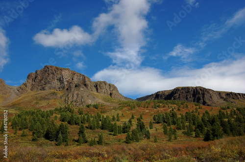 Mountain pass between mesas. Sayan Mountains, Russia.