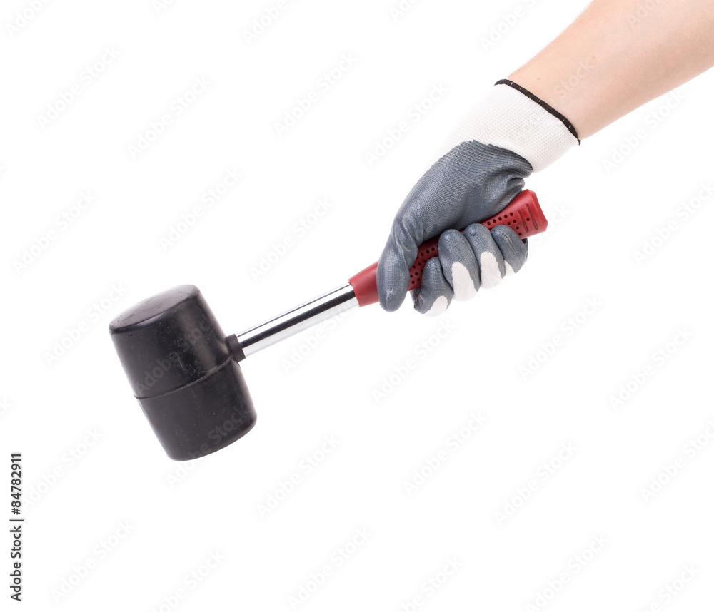Man's hand in glove holds hammer. Man's hand in glove holds hammer.
