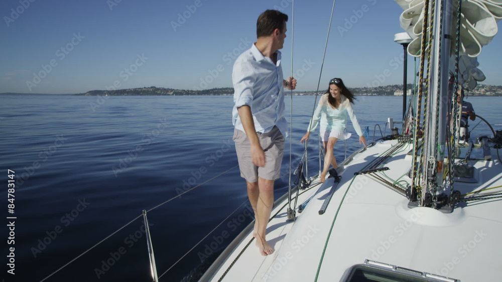 Young couple on sailboat together. Young couple on sailboat together.