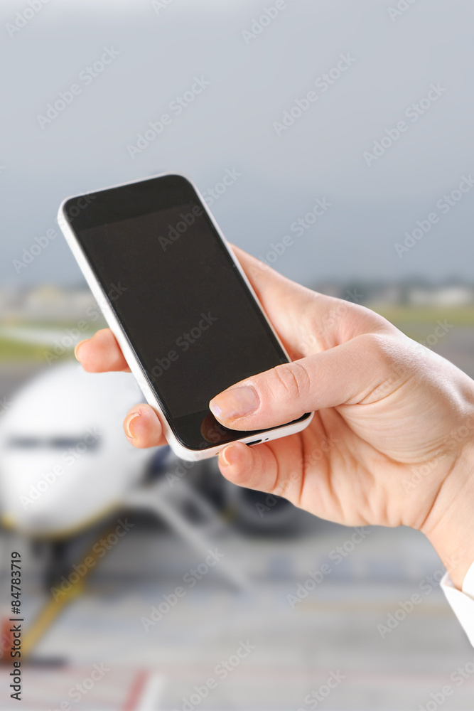hand using Smartphone in the airport hand using Smartphone in the airport