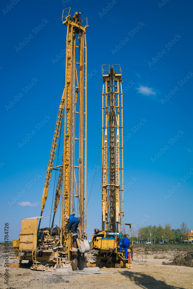 Pile driving machine in construction site Pile driving machine in construction site