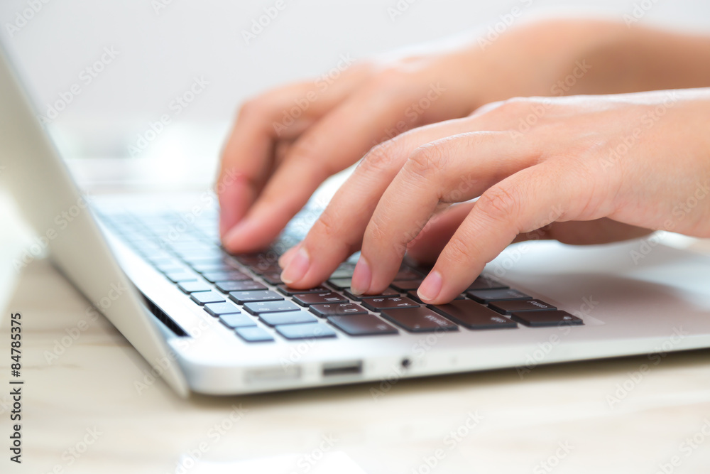 Closeup of business woman hand typing on laptop keyboard Closeup of business woman hand typing on laptop keyboard
