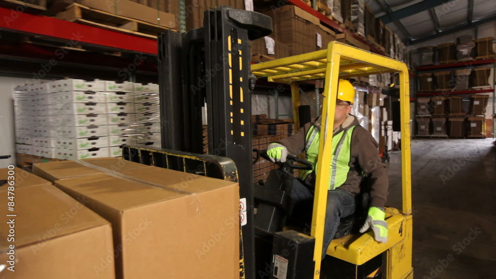 Forklift operator in a shipping warehouse