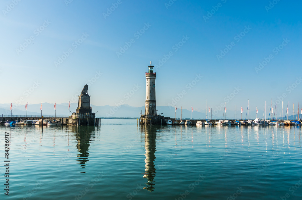 Harbor of Lindau at morning and lighthouse in lake Constance Harbor of Lindau at morning and lighthouse in lake Constance