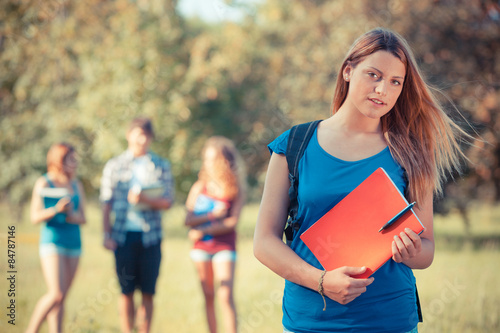 Young Female Student at Park with Other Friends