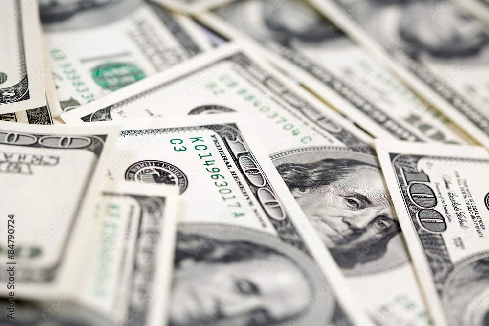 A pile of one hundred dollar bills