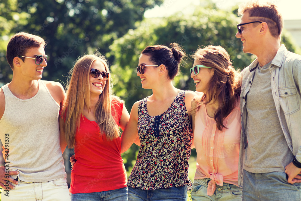 group of smiling friends outdoors