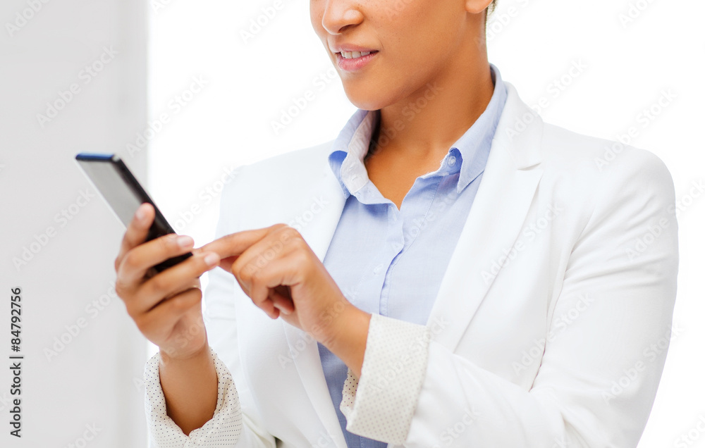 african businesswoman with smartphone in office african businesswoman with smartphone in office