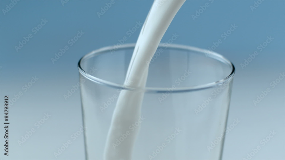 Milk pouring and splahsing in slow motion Milk pouring and splahsing in slow motion