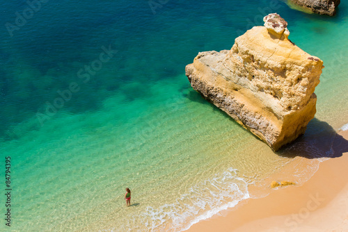 Girl relaxing at the Beautiful Beach in Algarve, Portugal