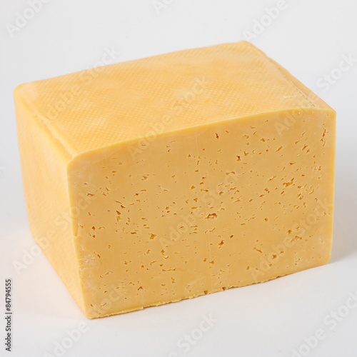 block of cheese on a white background