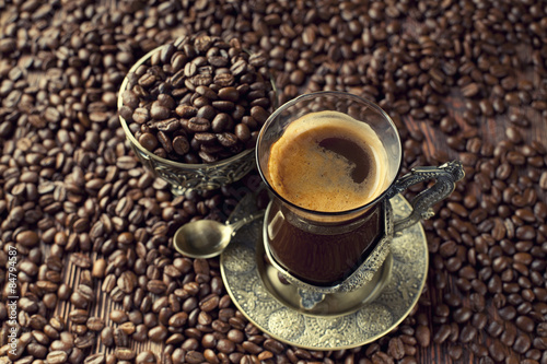 Cup of coffee and coffee grains © digieye